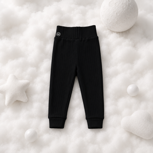 ECLIPSE baby lounge PJ pants in black — tapered fit, ribbed ankle cuffs, flat lay