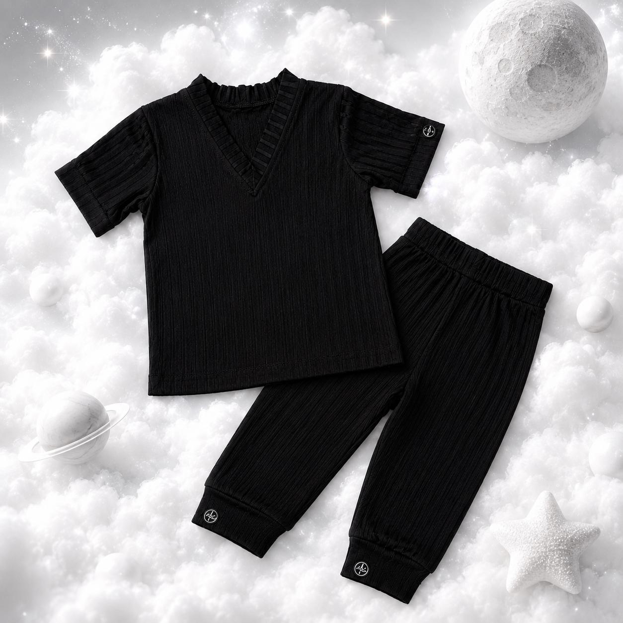 ECLIPSE baby lounge PJ set — top and pants together, flat lay, monochrome black
