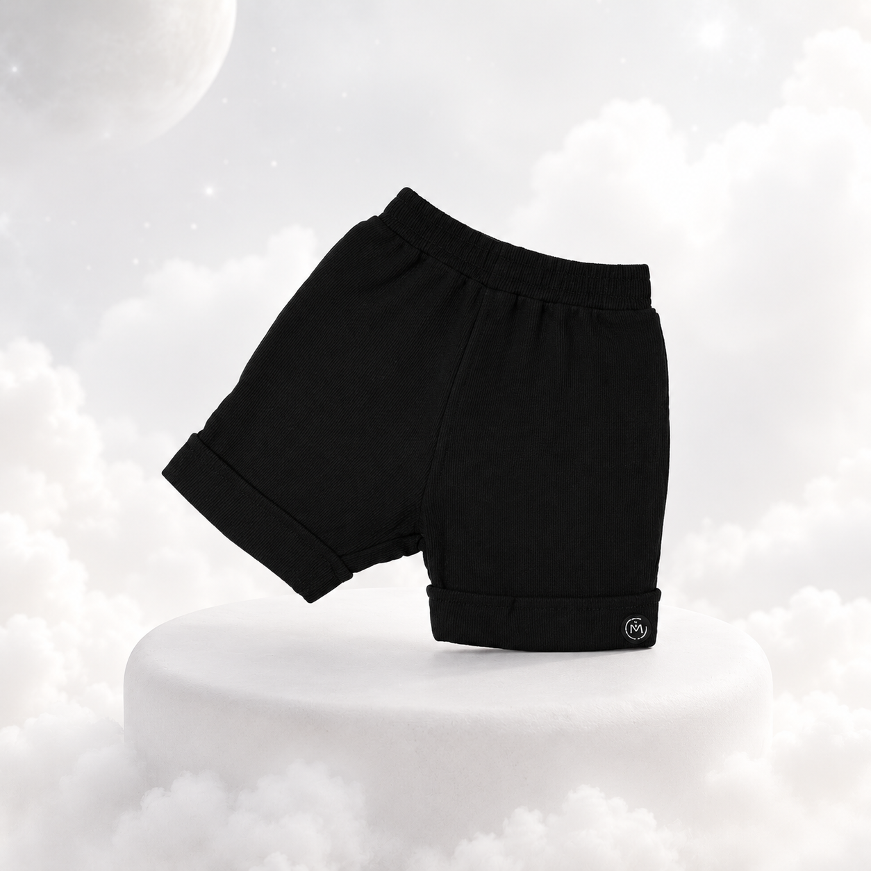 ECLIPSE baby shorts in monochrome black — front flat lay, elasticated waist, 100% cotton
