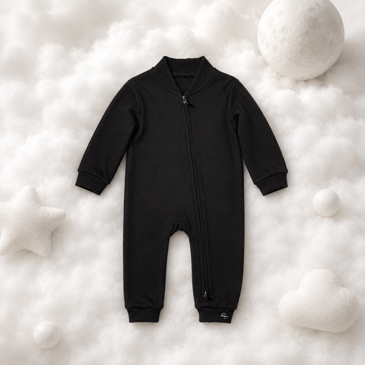 ECLIPSE long sleeved baby romper in black — full-length zip, ribbed cuffs, flat lay
