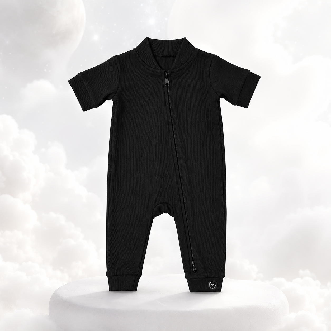 ECLIPSE short sleeved baby romper in black — full-length zip, ribbed ankle cuffs, flat lay
